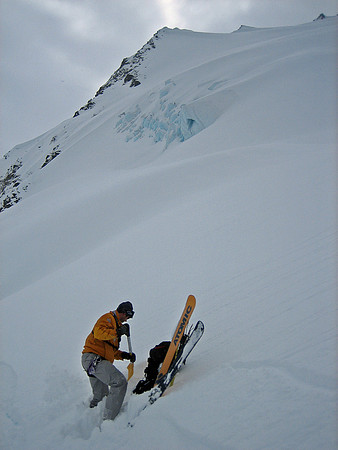 PNH guide Will Padden snow pit digging on 'Guilt Trip'